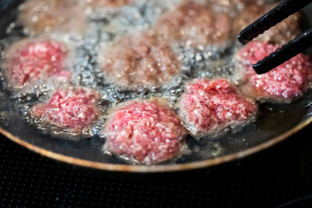 Frying beef meat balls in oilの写真素材