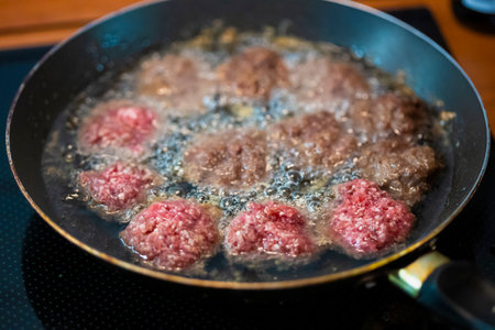Frying beef meat balls in oilの写真素材