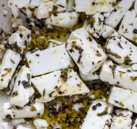 Dice sliced greek feta cheese ith spicesの写真素材