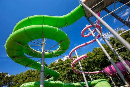 Yellow and green water slide in aquaparkの写真素材