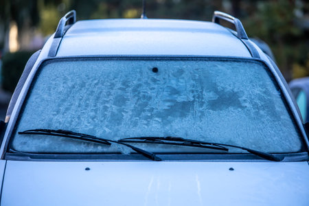 Frosted ice on car windscreen in winterの写真素材