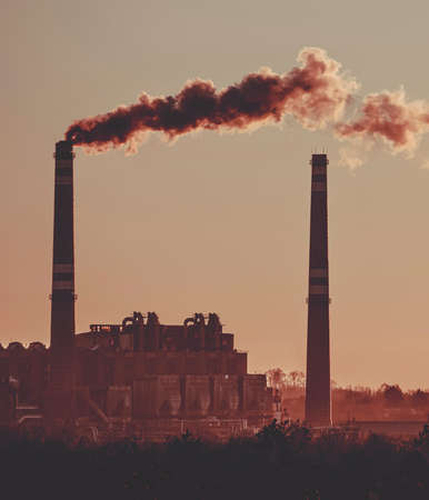 Power station with smoking chimney