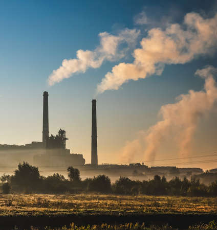 Power station with smoking chimney