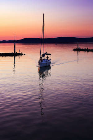 Sailing boat at sunset in the Adriatic Sea, Croatiaの写真素材