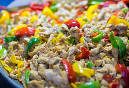 Stir fried chicken fillet with colorful bell peppers in a panの写真素材