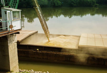 The process of pouring material into the river.の写真素材