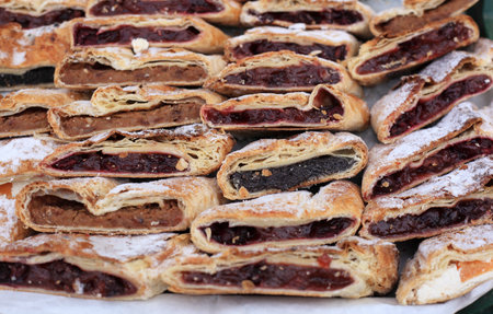 Heap of delicoius strudel stuffed with poppy apfel and cherryの写真素材