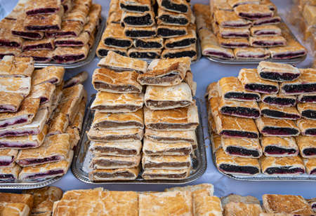 Heap of delicoius strudel stuffed with poppy apfel and cherryの写真素材