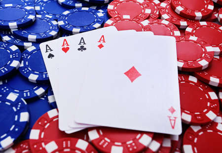 Four aces on red and blue tokens