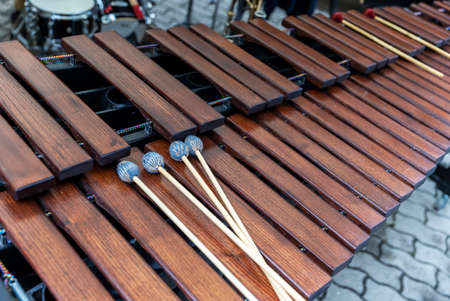 Huge wooden xylophone percussion instrument with drumsticksの写真素材