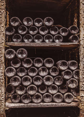 Stack of wine bottles in cellar
