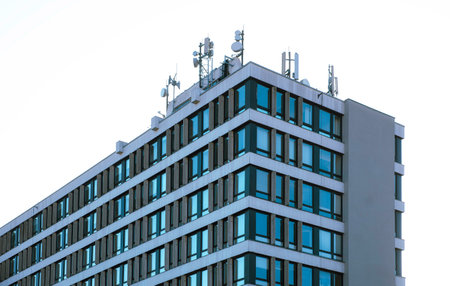 Detail of modern skyscraper at white sky
