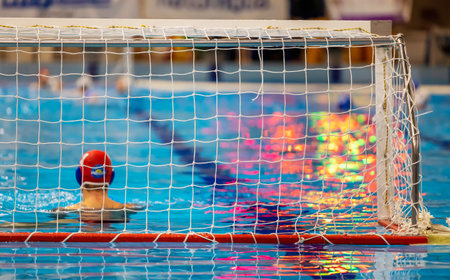 Water polo match with goalkeeper in gate
