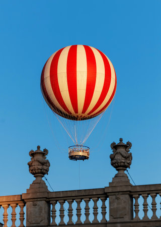 Stripped air balloon fly in blue skyの写真素材