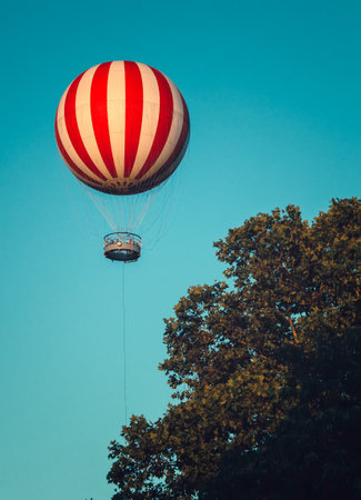 Stripped air balloon fly in blue skyの写真素材