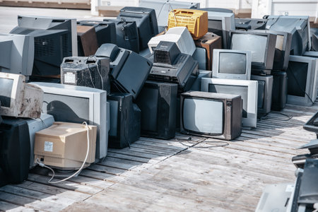 Heap of electronical appliances waste, monitors and TVs