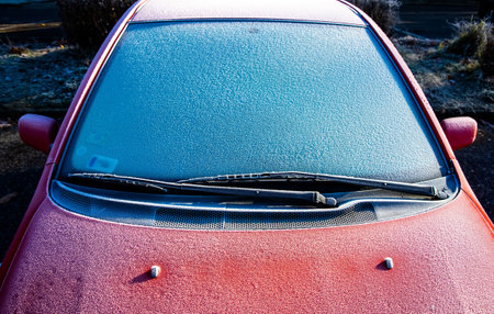 Morning frost on car glass in winterの写真素材