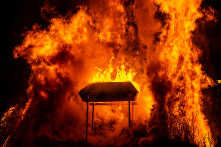 Burning coffin in huge bonfireの写真素材