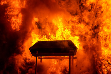 Burning coffin in huge bonfireの写真素材