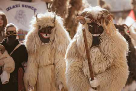 MOHACS, HUNGARY - MARCH 4: Unidentified people in mask participants at the Mohacsi Busojaras, it is a carnival for spring greetings) March 4, 2025 in Mohacs, Hungaryの写真素材