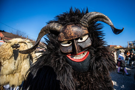 MOHACS, HUNGARY - MARCH 4: Unidentified people in mask participants at the Mohacsi Busojaras, it is a carnival for spring greetings) March 4, 2025 in Mohacs, Hungaryの写真素材