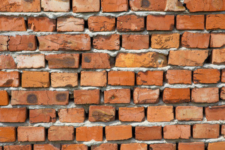 Detail of old damaged brick wallの写真素材