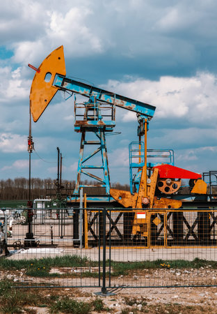 Working pumpjack extracting crude oil