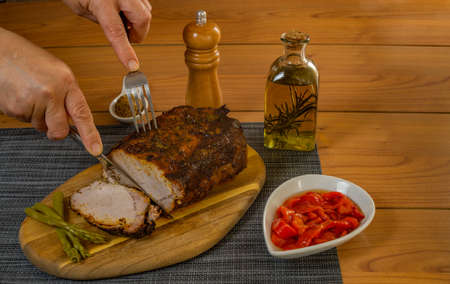 roasted pork loin with spices olive oil and peppersの写真素材