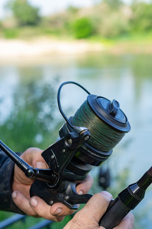 fishing session in the ebro river adult man with beard carp fishing