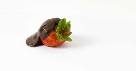 strawberries with chocolate on white backgroundの写真素材