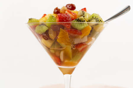 fresh summer fruit salad on a white backgroundの写真素材