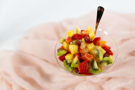 fresh summer fruit salad on a white backgroundの写真素材