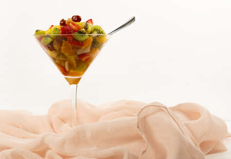fresh summer fruit salad on a white backgroundの写真素材