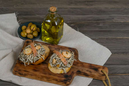 gulas with garlic prawns in earthenware casserole dishの写真素材