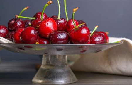fresh red summer cherries with water dropsの写真素材