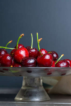 fresh red summer cherries with water dropsの写真素材