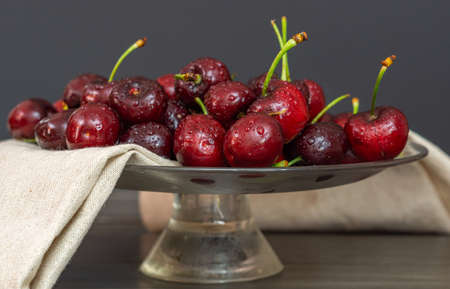 fresh red summer cherries with water dropsの写真素材