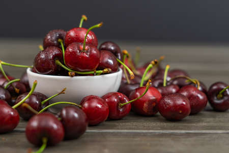 fresh red summer cherries with water dropsの写真素材