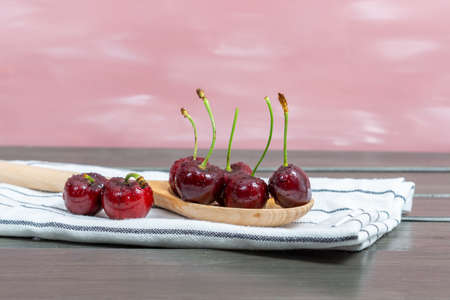 fresh red summer cherries with water dropsの写真素材