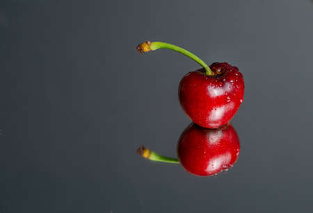 fresh red summer cherries with water dropsの写真素材