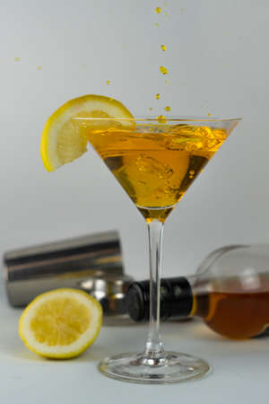 cocktail glasses with different flavors and colors with splash effectの写真素材