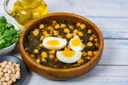 chickpeas with spinach and eggの写真素材
