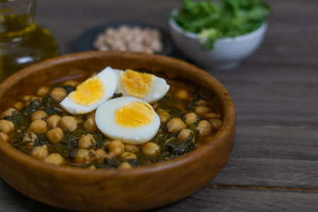 chickpeas with spinach and eggの写真素材