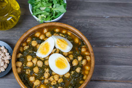 chickpeas with spinach and eggの写真素材