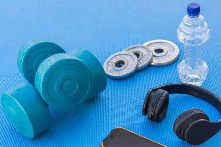 weights and fitness training equipment on the gym floorの写真素材