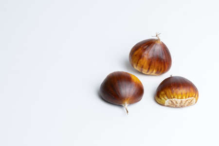 seasonal chestnuts harvested from the field on a white backgroundの写真素材