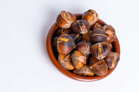 seasonal chestnuts harvested from the field on a white backgroundの写真素材