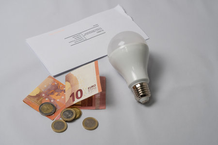 light bulb and money energy saving concept, electricity billの写真素材