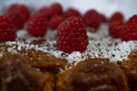 sweet potato and raspberry sponge cake with liquid caramel topped with shredded coconut