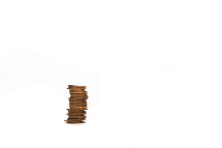 close-up of single coins on white background and copy spaceの写真素材